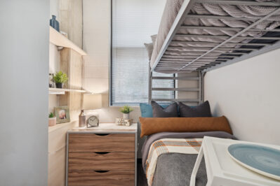 Bedroom with a large window and bunkbeds