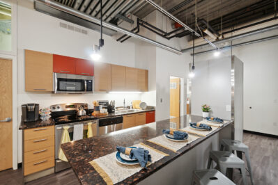 Kitchen with stainless steel appliances and breakfast bar