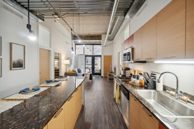 Kitchen with stainless steel appliances and breakfast bar